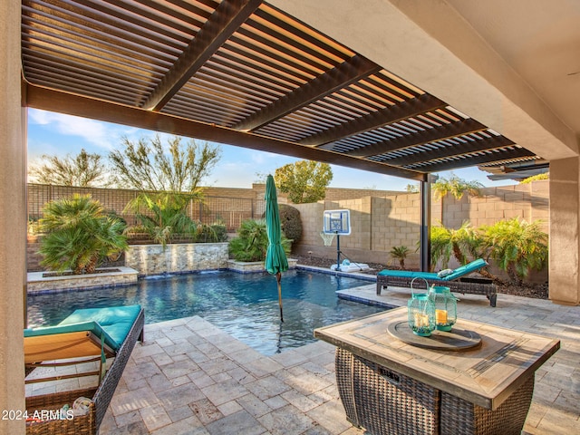 view of swimming pool featuring a pergola, pool water feature, and a patio