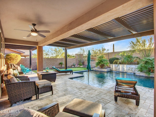 view of swimming pool with pool water feature, ceiling fan, a patio area, and an outdoor hangout area