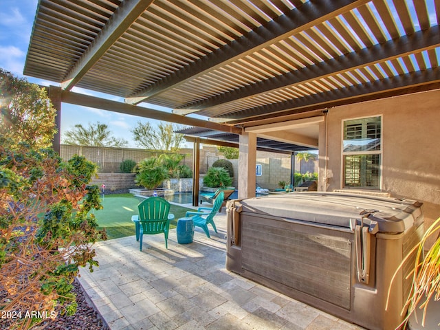 view of patio / terrace featuring a pergola and a hot tub