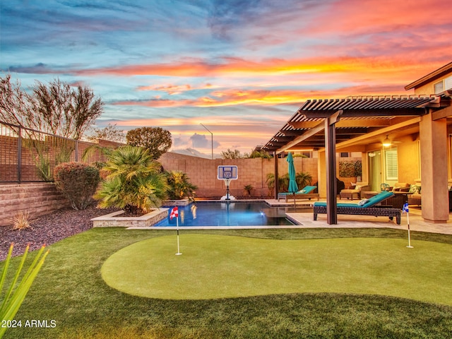 pool at dusk with an outdoor living space, a patio area, and a pergola