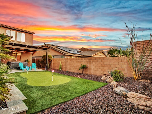 view of yard at dusk