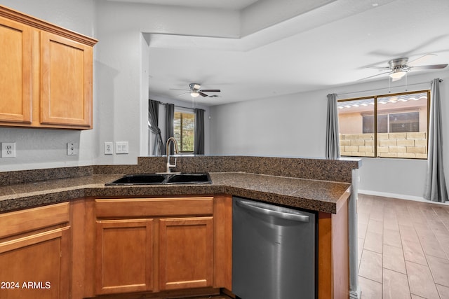 kitchen with kitchen peninsula, ceiling fan, sink, dishwasher, and light hardwood / wood-style floors