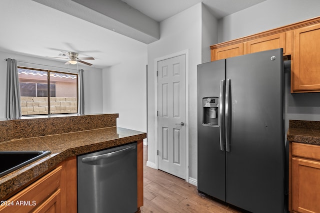 kitchen featuring ceiling fan, light hardwood / wood-style floors, and appliances with stainless steel finishes