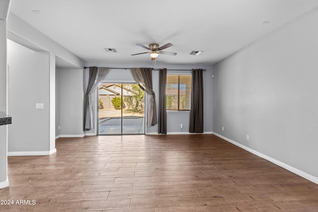 spare room featuring ceiling fan and light hardwood / wood-style floors