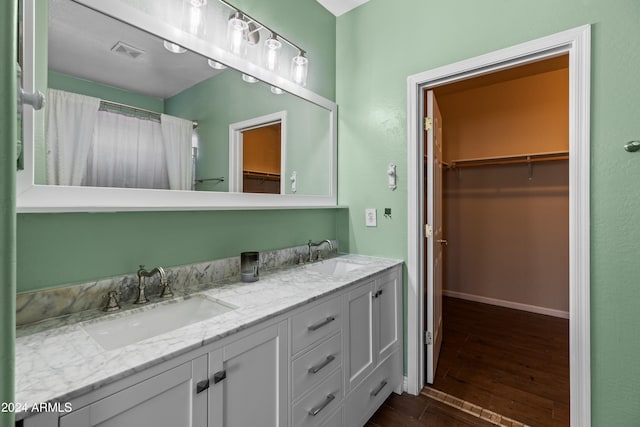 bathroom featuring hardwood / wood-style floors and vanity