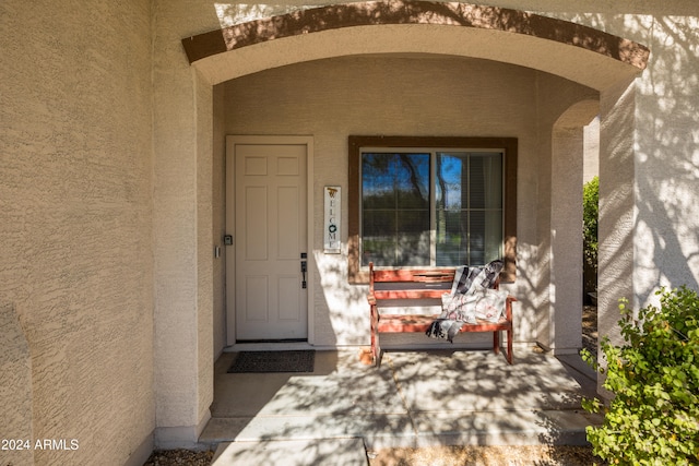 doorway to property with a porch