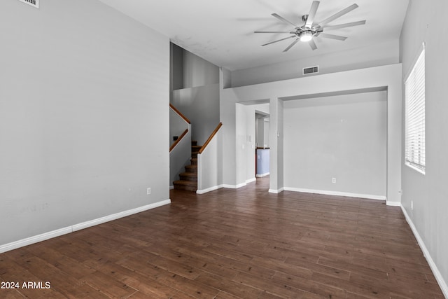 interior space with ceiling fan and dark wood-type flooring