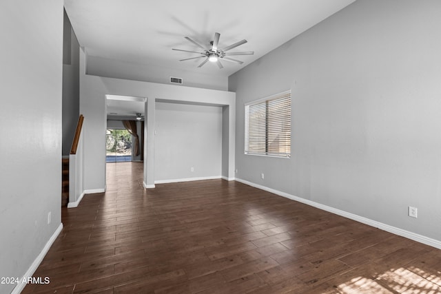 empty room featuring ceiling fan and dark wood-type flooring