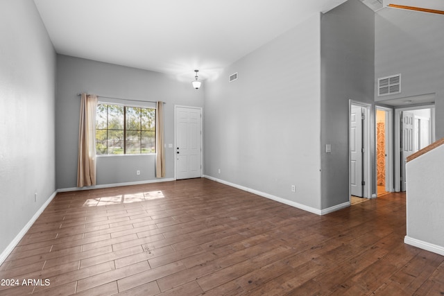 empty room with dark hardwood / wood-style floors