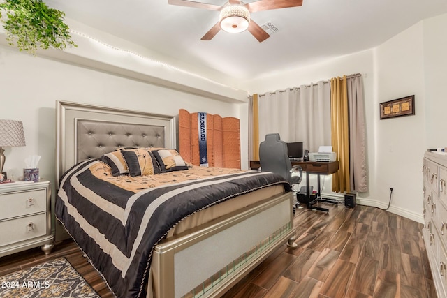 bedroom featuring ceiling fan and dark wood-type flooring