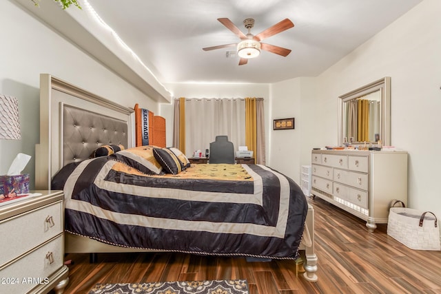 bedroom featuring ceiling fan and dark hardwood / wood-style flooring