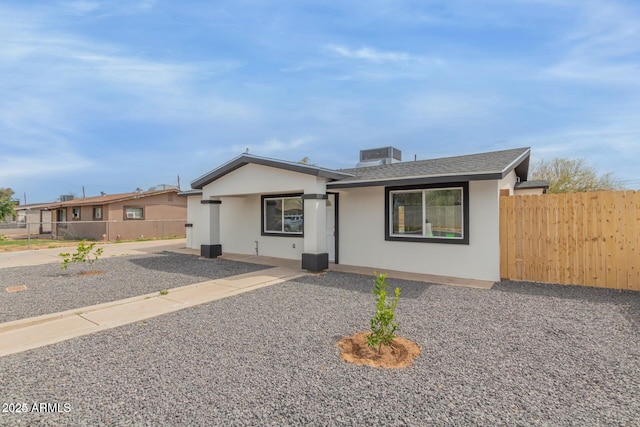 ranch-style house with cooling unit