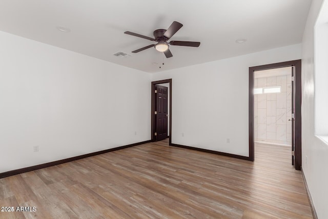 unfurnished room featuring light hardwood / wood-style floors and ceiling fan