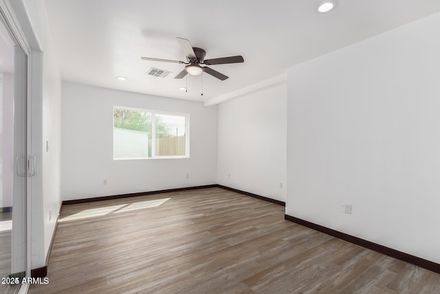 unfurnished room featuring ceiling fan and wood-type flooring