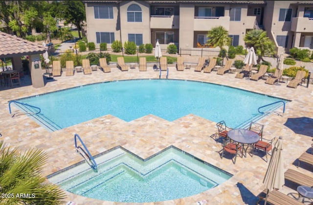 9451 E Becker Ln Unit 1051, Scottsdale, AZ 85260 - community pool with a patio and a community hot tub