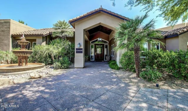 9451 E Becker Ln Unit 1051, Scottsdale, AZ 85260 - entrance to property with stucco siding and a tiled roof