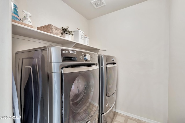 washroom with washer and clothes dryer