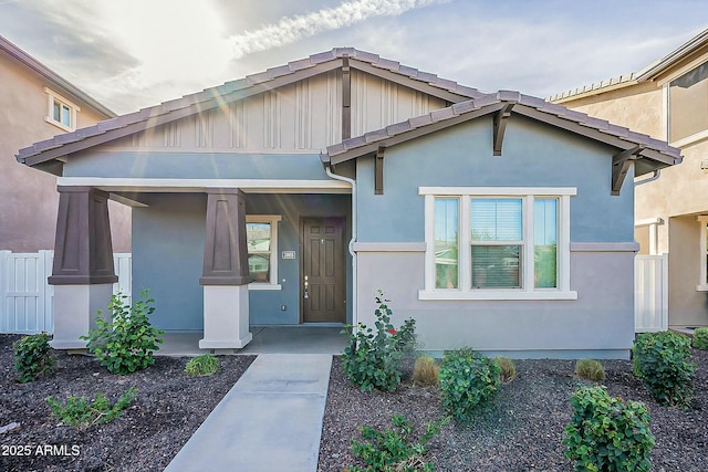 view of front of home with a porch and stucco siding