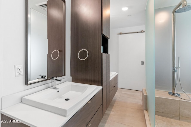 bathroom with vanity and tile patterned flooring