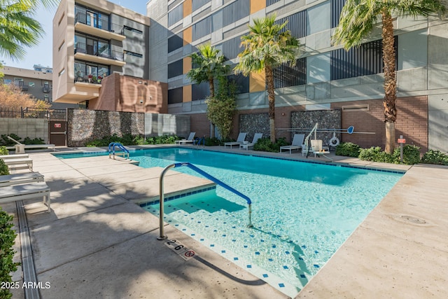 view of swimming pool with a patio area