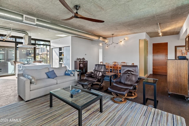 living room with wood-type flooring and ceiling fan