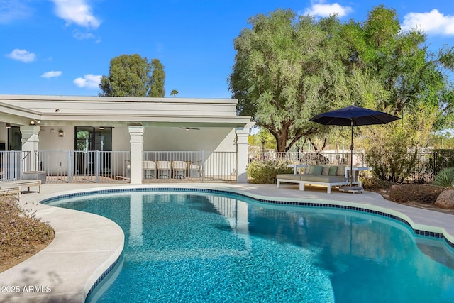 view of swimming pool with a patio, fence, and a fenced in pool