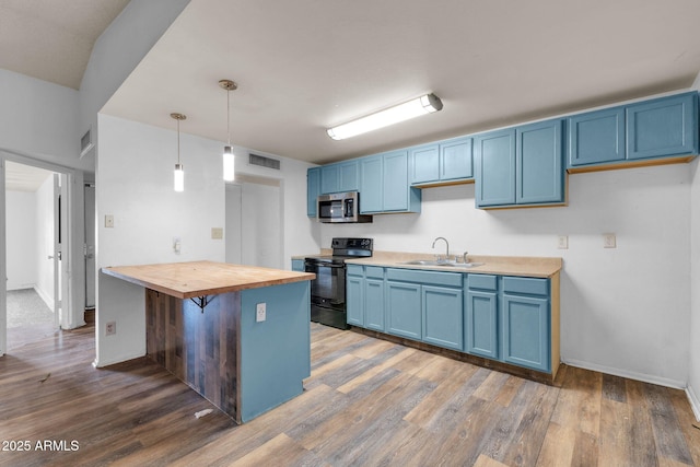 kitchen with blue cabinets, sink, wooden counters, decorative light fixtures, and black range with electric cooktop