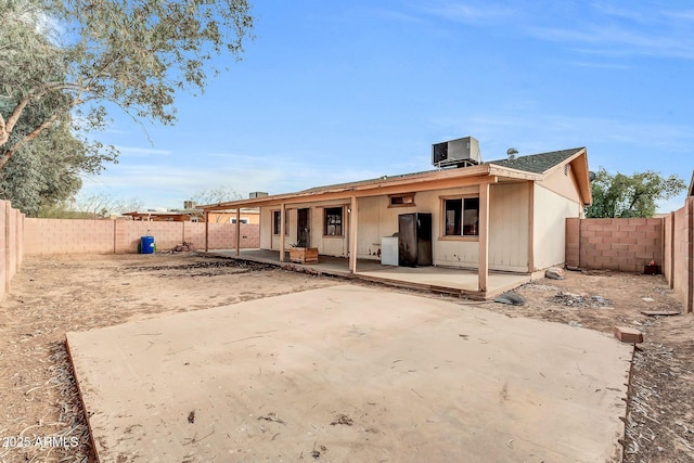 back of house featuring a patio area and central air condition unit