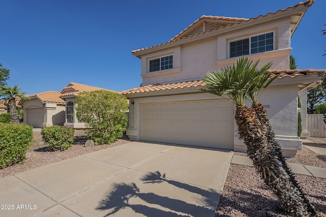 1610 W Maplewood St, Chandler, AZ 85286 - mediterranean / spanish-style house with a tiled roof, driveway, stucco siding, and a garage