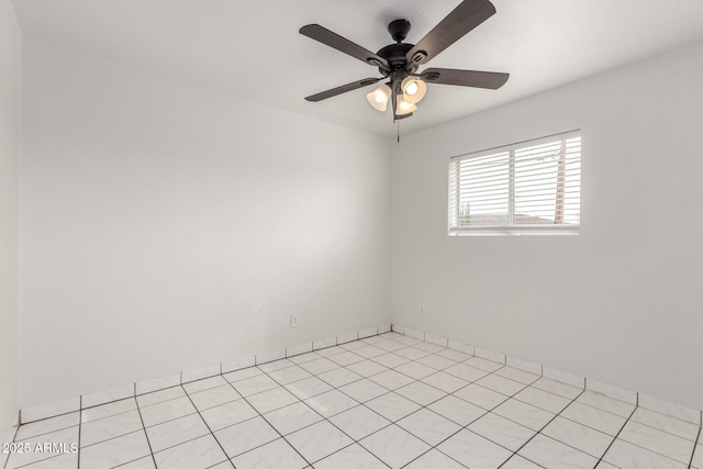 spare room with ceiling fan