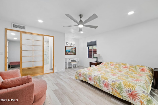 bedroom featuring light hardwood / wood-style floors and ceiling fan