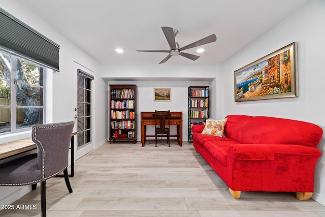 office space with ceiling fan and light hardwood / wood-style floors