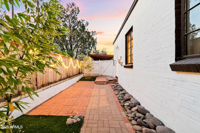 view of patio terrace at dusk