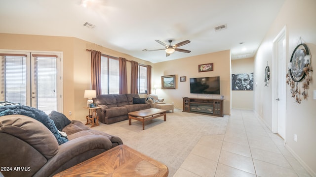 tiled living room with ceiling fan