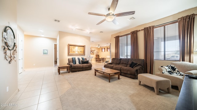 tiled living room featuring ceiling fan