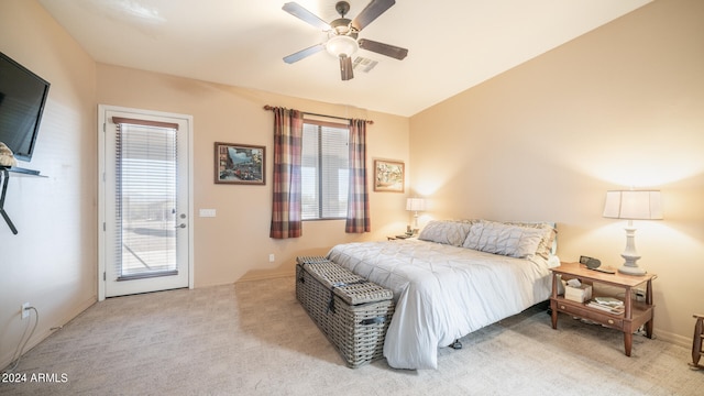 carpeted bedroom with vaulted ceiling, access to outside, and ceiling fan