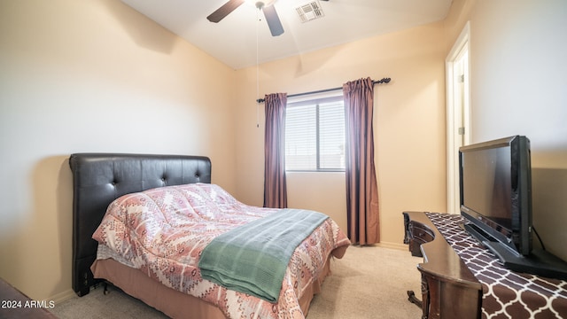 carpeted bedroom featuring lofted ceiling and ceiling fan