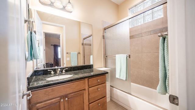 bathroom with vanity, tile patterned floors, and shower / bath combination with glass door