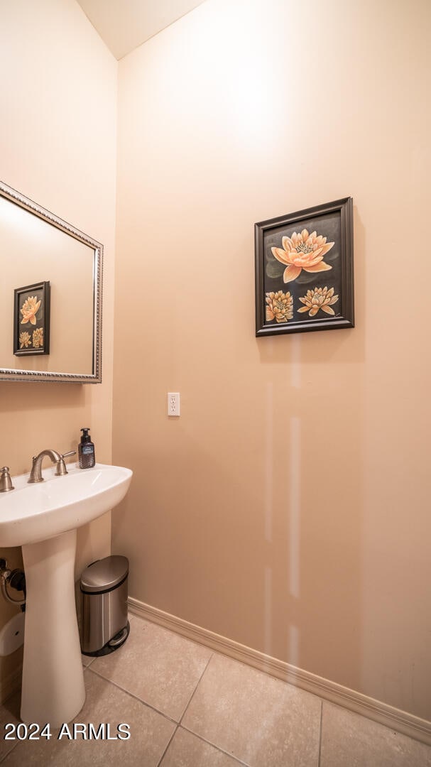 bathroom featuring sink and tile patterned flooring