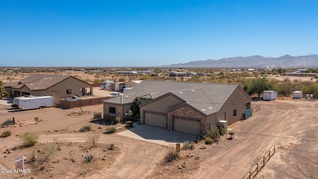 birds eye view of property with a mountain view