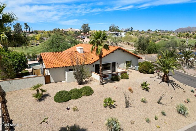 16804 E Monterey Dr, Fountain Hills, AZ 85268 - view of front facade featuring a mountain view, stucco siding, a tile roof, and fence