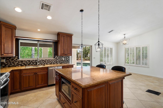 16804 E Monterey Dr, Fountain Hills, AZ 85268 - kitchen with a sink, decorative backsplash, stainless steel appliances, and visible vents