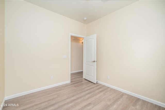 spare room with light wood-type flooring