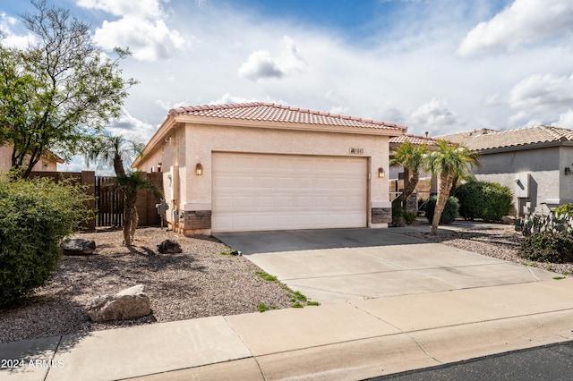 mediterranean / spanish house featuring a garage