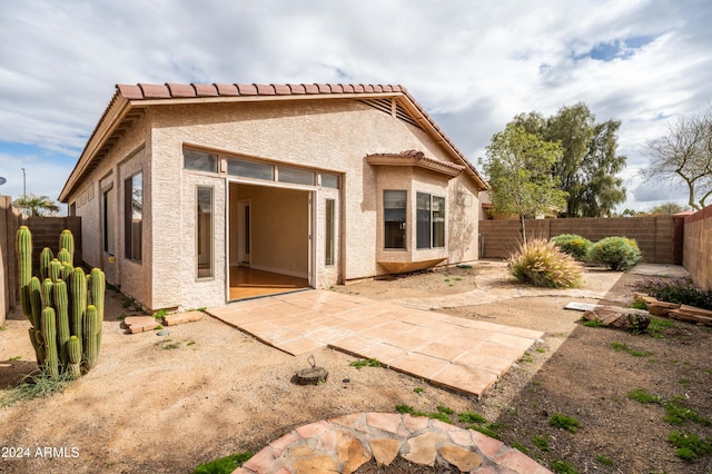 rear view of house featuring a patio