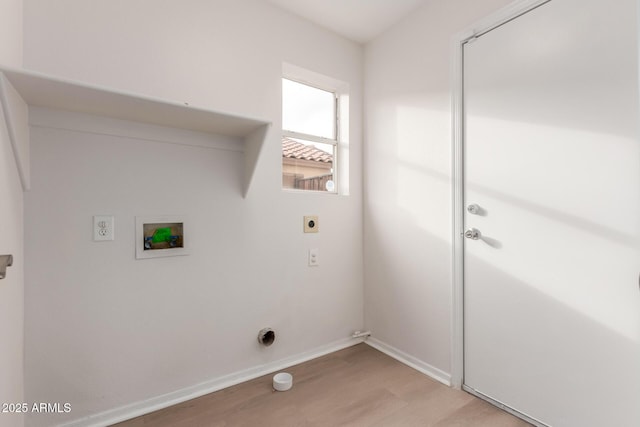 clothes washing area with washer hookup, light wood-style floors, baseboards, hookup for an electric dryer, and laundry area