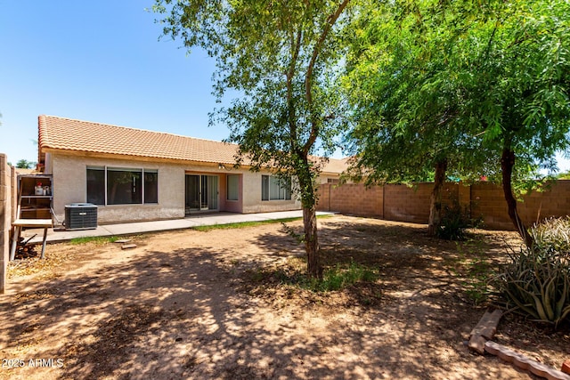 8341 W Cypress St, Phoenix, AZ 85037 - back of property with a tile roof, a fenced backyard, and stucco siding