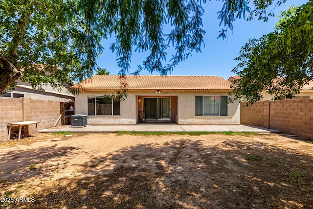 8341 W Cypress St, Phoenix, AZ 85037 - back of property featuring a tiled roof, stucco siding, and a patio