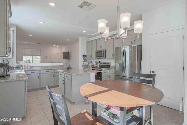 dining area with light tile patterned flooring and sink