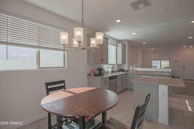 dining room with light tile patterned flooring and sink